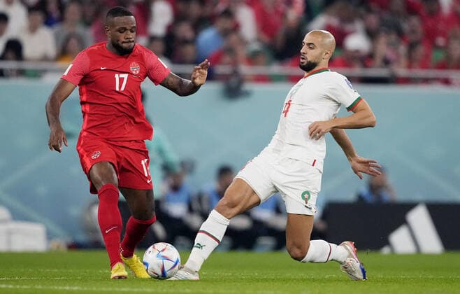 Mandatory Credit: Photo by Dave Shopland Shutterstock (13640369cj) Sofyan Amrabat of Morocco and Cyle Larin of Canada. Canada v Morocco, FIFA World Cup, WM, Weltmeisterschaft, Fussball 2022, Group F, Football, Al Thumama Stadium, Doha, Qatar - 01 Dec 2022 Editorial Use Only Canada v Morocco, FIFA World Cup 2022, Group F, Football, Al Thumama Stadium, Doha, Qatar - 01 Dec 2022 Editorial Use Only Copyright: xDavexShopland Shutterstockx 13640369cj