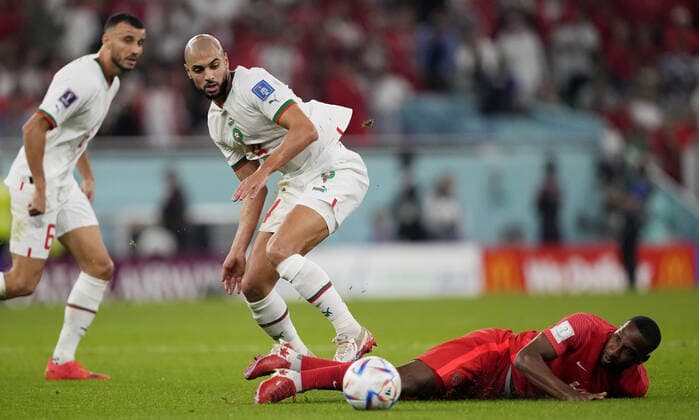 Mandatory Credit: Photo by Dave Shopland Shutterstock (13640369cp) Sofyan Amrabat of Morocco and Junior Hoilett of Canada. Canada v Morocco, FIFA World Cup, WM, Weltmeisterschaft, Fussball 2022, Group F, Football, Al Thumama Stadium, Doha, Qatar - 01 Dec 2022 Editorial Use Only Canada v Morocco, FIFA World Cup 2022, Group F, Football, Al Thumama Stadium, Doha, Qatar - 01 Dec 2022 Editorial Use Only Copyright: xDavexShopland Shutterstockx 13640369cp