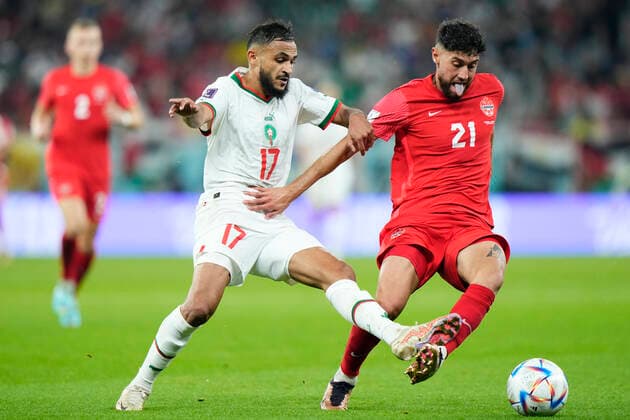 Canada v Morocco: Group F - FIFA World Cup, WM, Weltmeisterschaft, Fussball Qatar 2022 Sofiane Boufal left winger of Morocco and Angers SCO and Jonathan Osorio Central Midfield of Canada and Toronto FC compete for the ball during the FIFA World Cup Qatar 2022 Group F match between Canada and Morocco at Al Thumama Stadium on December 1, 2022 in Doha, Qatar. Doha Qatar  Copyright: xJosexBretonx originalFilename:breton-canadavm221201_npgpq.jpg
