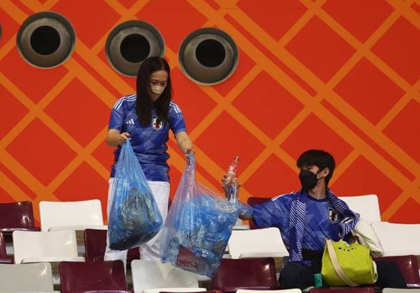 FIFA World Cup 2022, Japan - Spain, Japanese fans collect rubbish in the stands