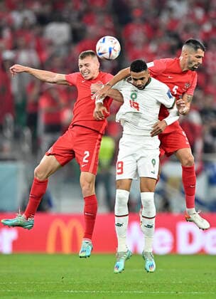 (221201) -- DOHA, Dec. 1, 2022 -- Youssef En-Nesyri (C) of Morocco vies with Alistair Johnston (L) and Steven Vitoria of Canada during their Group F match at the 2022 FIFA World Cup, WM, Weltmeisterschaft, Fussball at Al Thumama Stadium in Doha, Qatar, Dec. 1, 2022. ) (SP)QATAR-DOHA-2022 WORLD CUP-GROUP F-CAN VS MAR XinxYuewei 