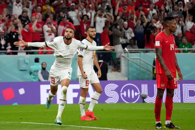 (221201) -- DOHA, Dec. 1, 2022 -- Youssef En-Nesyri (L) of Morocco celebrates a goal which is ruled out for offside during the Group F match between Canada and Morocco at the 2022 FIFA World Cup, WM, Weltmeisterschaft, Fussball at Al Thumama Stadium in Doha, Qatar, Dec. 1, 2022. ) (SP)QATAR-DOHA-2022 WORLD CUP-GROUP F-CAN VS MAR LixGang 