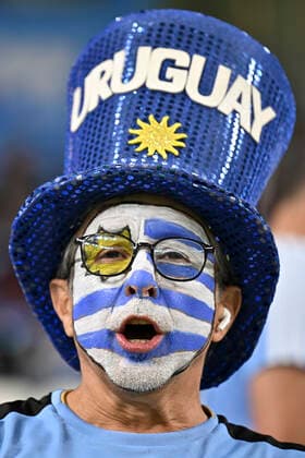 (221202) -- AL WAKRAH, Dec. 2, 2022 -- A fan of Uruguay cheers for the team before the Group H match between Ghana and Uruguay at the 2022 FIFA World Cup, WM, Weltmeisterschaft, Fussball at Al Janoub Stadium in Al Wakrah, Qatar, Dec. 2, 2022. ) (SP)QATAR-AL WAKRAH-2022 WORLD CUP-GROUP H-GHA VS URU XinxYuewei 