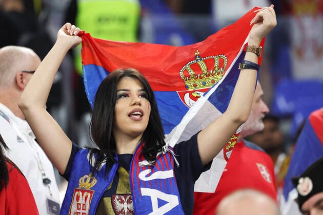 (221202) -- DOHA, Dec. 2, 2022 -- A fan of Serbia cheers for the team before the Group G match between Serbia and Switzerland at the 2022 FIFA World Cup, WM, Weltmeisterschaft, Fussball at Stadium 974 in Doha, Qatar, Dec. 2, 2022. ) (SP)QATAR-DOHA-2022 WORLD CUP-GROUP G-SRB VS SUI XuxZijian 