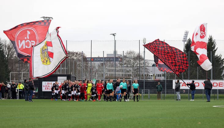 04 12 2022 football season 2022 2023 2 women football 2 Bundesliga 10 matchday 1 FC Nürnberg FCN Club FC Ingolstadt 04 FCI DaMa symbol picture symbol photo feature impression teams teams run on field on swivel flags of club fans club fans FCN fans fans