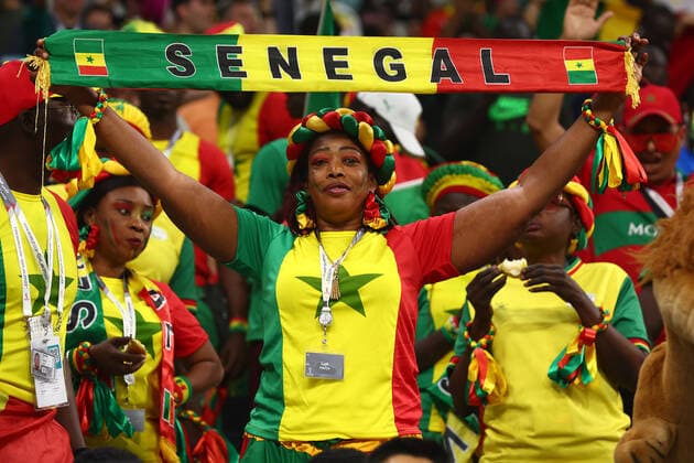 A Senegal fan supports her team during the 2022 FIFA World Cup, WM, Weltmeisterschaft, Fussball Round of 16 match at Al Bayt Stadium in Al Khor, Qatar on December 04, 2022.  ALK20221204110 CHRISxBRUNSKILL