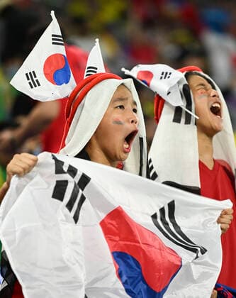 (221205) -- DOHA, Dec. 5, 2022 -- Fans of South Korea cheer for the team before the Round of 16 match between Brazil and South Korea at the 2022 FIFA World Cup, WM, Weltmeisterschaft, Fussball at Ras Abu Aboud (974) Stadium in Doha, Qatar, Dec. 5, 2022. ) (SP)QATAR-DOHA-2022 WORLD CUP-ROUND OF 16-BRA VS KOR LixGa 