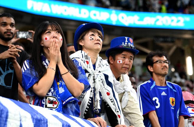 AL WAKRAH, QATAR - DECEMBER 05: Fans of Japan disappointed for the defeat ,during the FIFA World Cup, WM, Weltmeisterschaft, Fussball Qatar 2022 Round of 16 match between Japan and Croatia at Al Janoub Stadium on December 5, 2022 in Al Wakrah, Qatar. WCS 