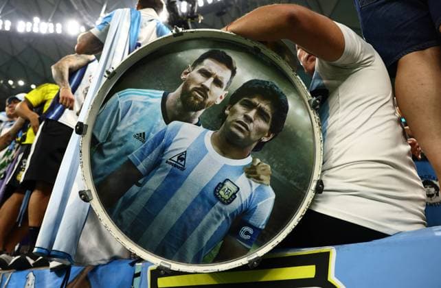 Doha, Qatar, 9th December 2022. Argentina fan with a portrait of Messi and Maradona on his drum during the FIFA World Cup, WM, Weltmeisterschaft, Fussball 2022 match at Lusail Stadium, Doha. Picture credit should read: David Klein Sportimage EDITORIAL USE ONLY. No use with unauthorised audio, video, data, fixture lists, club league logos or live services. Online in-match use limited to 120 images, no video emulation. No use in betting, games or single club league player publications. SPI-2091-0035