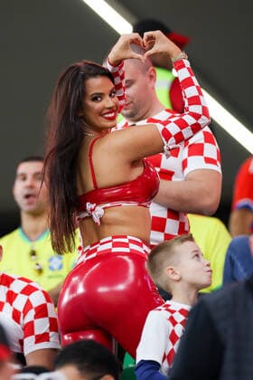 December 9, 2022, Doha, Qatar: IVANA KNOLL, former Miss Croatia shows off her rear right next to a young fans head during the FIFA World Cup, WM, Weltmeisterschaft, Fussball Qatar 2022 quarter final match between Croatia and Brazil at Education City Stadium. Doha Qatar - ZUMAv122 20221209_zap_v122_102 Copyright: xWilliamxVolcovx