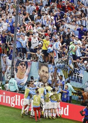 Football World Cup in Qatar Argentina supporters celebrate a Lionel Messi goal from the penalty spot during the second half of a World Cup quarterfinal football match against the Netherlands at Lusail Stadium in Lusail, Qatar, on Dec. 9, 2022.  A14AA0001373525P 