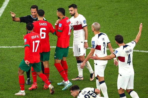 Mandatory Credit: Photo by Michael Zemanek Shutterstock (13655764bb) Referee Facundo Tello is confronted by Captain Romain Saiss of Morocco after he gave a foul against his side Morocco v Portugal, FIFA World Cup, WM, Weltmeisterschaft, Fussball 2022, Quarter Final, Football, Al Thumama Stadium, Doha, Qatar - 10 Dec 2022 Editorial Use Only Morocco v Portugal, FIFA World Cup 2022, Quarter Final, Football, Al Thumama Stadium, Doha, Qatar - 10 Dec 2022 Editorial Use Only Copyright: xMichaelxZemanek Shutterstockx 13655764bb