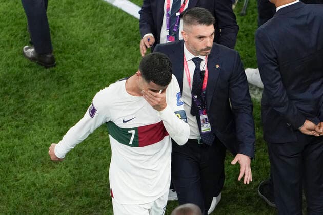 (221210) -- DOHA, Dec. 10, 2022 -- Cristiano Ronaldo of Portugal leaves the pitch after they lost the Quarterfinal between Morocco and Portugal of the 2022 FIFA World Cup, WM, Weltmeisterschaft, Fussball at Al Thumama Stadium in Doha, Qatar, Dec. 10, 2022. ) (SP)QATAR-DOHA-2022 WORLD CUP-QUARTERFINAL-MAR VS POR ZhengxHuansong 