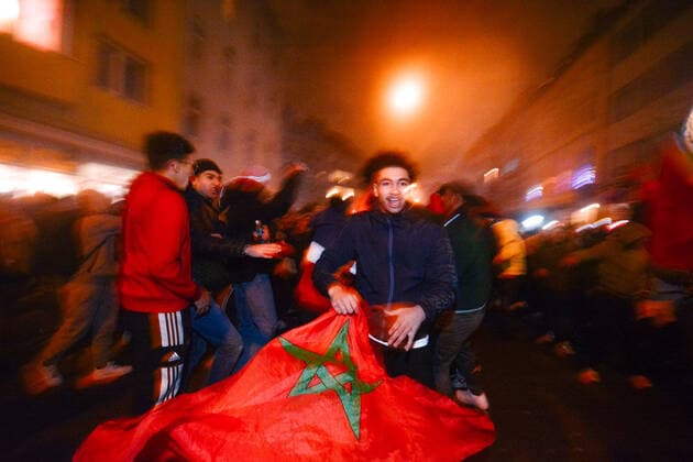 Morocco Football Fans Celebrate In Duesseldorf a Morocco football fans holds a Morocco flag is seen celebrating near Duesseldorf central station in Duesseldorf, Germany on December 10, 2022 after Morocco kocks portugal out of World Cup Duesseldorf Germany  Copyright: xYingxTangx originalFilename:tang-notitle221210_npcSG.jpg