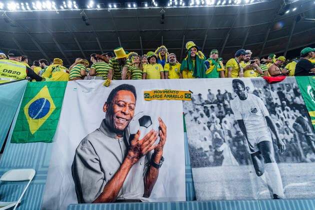 DOHA, QATAR - DECEMBER 05: Brazil fans with large Pele banner during the round of 16 match of the 2022 FIFA World Cup, WM, Weltmeisterschaft, Fussball in Qatar between Brazil and South Korea on December 5, 2022, at Stadium 974 in Doha, Qatar. (Photo by Richard Gordon Icon Sportswire) SOCCER: DEC 05 FIFA World Cup - South Korea v Brazil Icon221205979