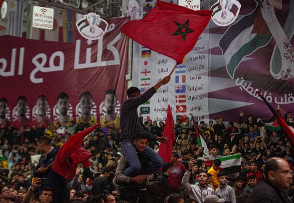 December 10, 2022, Gaza City, Gaza Strip, Palestine: Gaza, Palestine. December 10, 2022. Palestinians in Gaza City watch on a big screen the live broadcast of the FIFA World Cup, WM, Weltmeisterschaft, Fussball quarter-final match between Morocco and Portugal that was held in Qatar. The match eventually ended with the victory of Morocco 1-0 Gaza City Palestine - ZUMAd99_ 0196427772st Copyright: xYousefxMohammedx