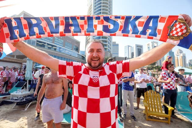 QATAR 2022 - Croatian fans unfurled a 200m long flag on the beach in front of the Hilton Doha Hotel Croatian fans unfurled a 200m long flag on the beach in front of the Hilton Doha Hotel to support the national team, Nationalteam before the semi-final match against Argentina at the World Cup in Qatar, in Doha, Qatar, on December 13, 2022, IgorxKralj PIXSELL