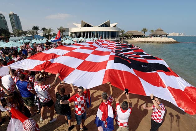 QATAR 2022 - Croatian fans unfurled a 200m long flag on the beach in front of the Hilton Doha Hotel Croatian fans unfurled a 200m long flag on the beach in front of the Hilton Doha Hotel to support the national team, Nationalteam before the semi-final match against Argentina at the World Cup in Qatar, in Doha, Qatar, on December 13, 2022, IgorxKralj PIXSELL
