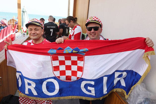 Croatia fans carry 200 meters flag Supporters of Croatia are seen prior FIFA World Cup, WM, Weltmeisterschaft, Fussball Qatar 2022 bronze medal match between Croatia and Morocco at Hilton Doha beach in Doha, Qatar on December 17, 2022. Fans carry 200 meters long flag of Croatia. GoranxStanzl PIXSELL