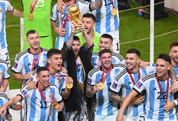 FOOTBALL World Cup 2022 Final Argentina France 18 12 2022 Argentina celebrates itself as world champion Lionel Messi right the cup in the air and celebrates with his teammates the world title