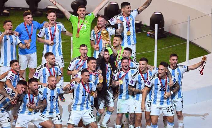 FOOTBALL World Cup 2022 Final Argentina France 18 12 2022 Argentina celebrates itself as world champion Lionel Messi right the cup in the air and celebrates with his teammates the world title