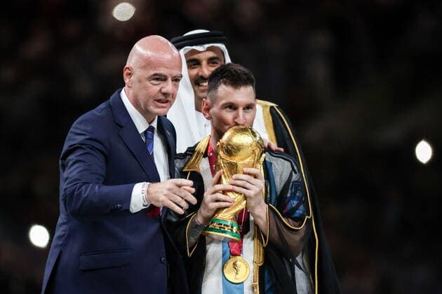 QATAR, LUSAIL - DECEMBER 18, 2022: FIFA president Gianni Infantino, Argentina captain Lionel Messi (L-R front) and Emir of Qatar Tamim bin Hamad Al Thani are seen during the trophy ceremony for the 2022 FIFA World Cup, WM, Weltmeisterschaft, Fussball final football match between Argentina and France at Lusail Iconic Stadium. Argentina won 3-3 (4-2) in a penalty shootout. Sergei Bobylev TASS  56487951