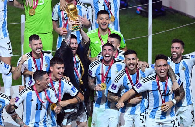 FOOTBALL World Cup 2022 Final Argentina France 18 12 2022 Argentina celebrates itself as world champion Lionel Messi raises the trophy and celebrates with his teammates the world title