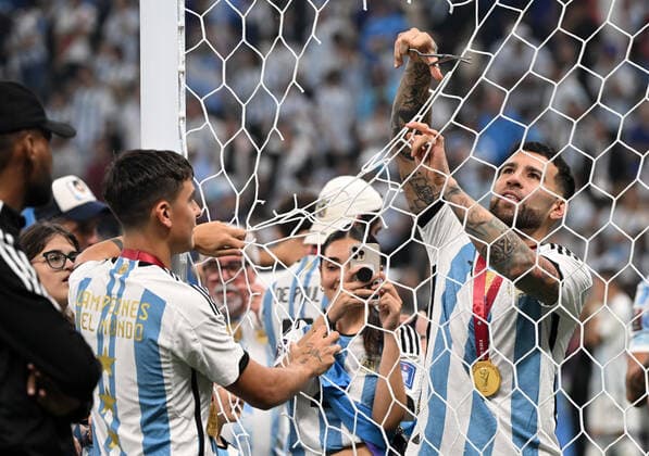 Football, men, 2022 23 season, Qatar World Cup, final, Argentina France at Lusail Iconic Stadium in Lusail, v l Paulo Dybala Argentina and Nicolas Otamendi Argentina cut off parts of the goal net as souvenirs, 18 12 2022, Copyright: xMatthiasxKochx