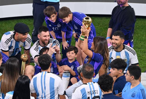 FOOTBALL World Cup 2022 Final Argentina France 18 12 2022 Lionel Messi Argentina photographs his wife Antonella Roccuzzo with World Cup trophy