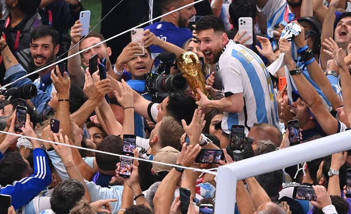 FOOTBALL World Cup 2022 Final Argentina France 18 12 2022 Argentina celebrates itself as world champion Lionel Messi cheers with the World Cup trophy in the crowd