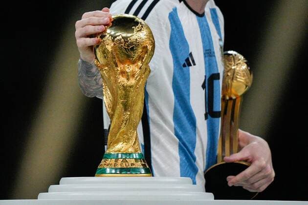 Mandatory Credit: Photo by Dave Shopland Shutterstock (13670813dv) Lionel Messi of Argentina strokes the FIFA World Cup, WM, Weltmeisterschaft, Fussball trophy as he collects the Golden Ball Award Argentina v France, FIFA World Cup 2022, Final, Football, Lusail Stadium, Al Daayen, Qatar - 18 Dec 2022 Editorial Use Only Argentina v France, FIFA World Cup 2022, Final, Football, Lusail Stadium, Al Daayen, Qatar - 18 Dec 2022 Editorial Use Only Copyright: xDavexShopland Shutterstockx 13670813dv