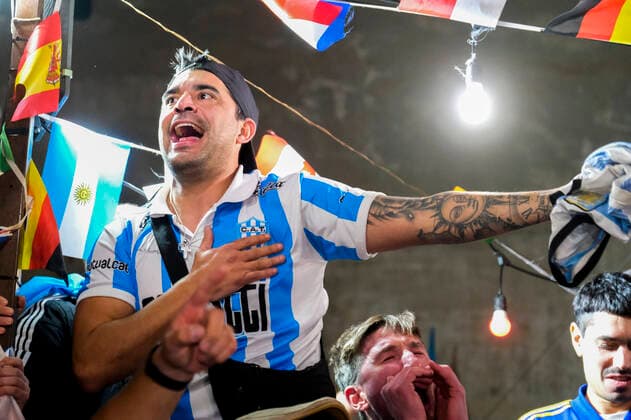 the argentinean celebration victory wolrd cup in naples Argentina world champion in Naples the Argentinean community together with Neapolitans celebrate the victory of the selection under the historic mural of Diego Armando Maradona in the Spanish quarters ABPH6860 Copyright: xAntonioxBalascox