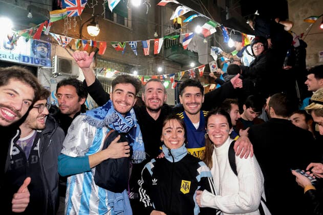 the argentinean celebration victory wolrd cup in naples Argentina world champion in Naples the Argentinean community together with Neapolitans celebrate the victory of the selection under the historic mural of Diego Armando Maradona in the Spanish quarters ABPH7016 Copyright: xAntonioxBalascox