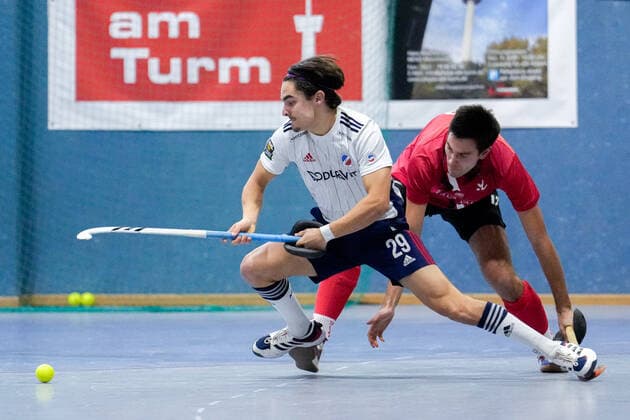 f le Nico Reichert MHC, 29 , Lukas Pfaff TSVMH, 12 , duel, tackle, tackling, dynamic, action, action, 18 12 2022, Mannheim Germany , indoor field hockey, 1 Bundesliga Süd, men, TSV Mannheim Mannheimer HC xozx