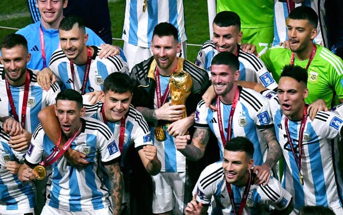 Football World Cup, Men, Qatar 2022, Final, Lusail Iconic Stadium, Argentina France 4 2 n E Lionel Messi ARG with trophy in the midst of his teammates jubilation, joy, action FIFA REGULATES PROHIBIT ANY USE OF PHOTOGRAPHS AS IMAGE SEQUENCES AND OR QUASI VIDEO