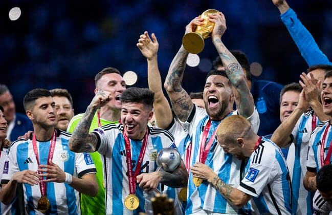 Doha, Qatar 18th Dec, 2022 Enzo Fernandez Arg , Nicolas Otamendi Arg lifts the FIFA World Cup Qatar 2022 Winner s Trophy , Alejandro Gomez Arg Argentina France Final Match Argentina France World Cup 2022 in Qatar 18 12 2022