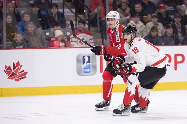 December 19, 2022, Moncton, NB, Canada: Switzerland s Nicolas Baechler and Canada s Adam Fantilli skate close to each other during first period IIHF World Junior Hockey Championship pre-tournament hockey action in Moncton, N.B., on Monday, Dec. 19, 2022. Canada News - December 19, 2022  - ZUMAc35_ 20221219_zaf_c35_061 Copyright: xRonxWardx