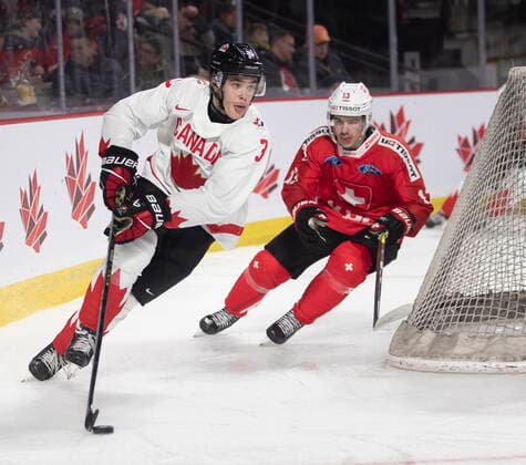 December 19, 2022, Moncton, NB, Canada: Switzerland™s Louis Robin chases Canada™s Olen Zellweger during third period IIHF World Junior Hockey Championship pre-tournament hockey action in Moncton, N.B., on Monday, Dec. 19, 2022. Canada News - December 19, 2022  - ZUMAc35_ 20221219_zaf_c35_069 Copyright: xRonxWardx