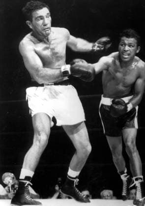 Joey Maxim Lightweight champion Joey Maxim (left) is driven back by a hard right from challenger Sugar Ray Robinson in the 5th round of the scheduled 15 round title bout at the Yankee Stadium, New York. Maxim retained his crown on a technical knock-out when Robinson, overcome by exhaustion, failed to come out for the 14th round. 27th June 1952. United States  Copyright: xTopFotox 0064390