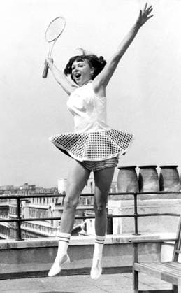 Gertrude Moran They called her Gorgeous Gussy Moran, the girl who made such an impact on the Centre Court at Wimbledon with her New Look tennis fashions. Gussy is back in England after eighteen years. She will attend the first-ever Open Wimbledon, and give demonstrations all this week at Simpson s of Piccadilly. Today at Simpson s she looked proud to wear a new Centre Court style ... a long torso line dress with ballerina skirt, made to match the stringing of a tennis racket. Great Britain  Copyright: xTopFotox 0200236