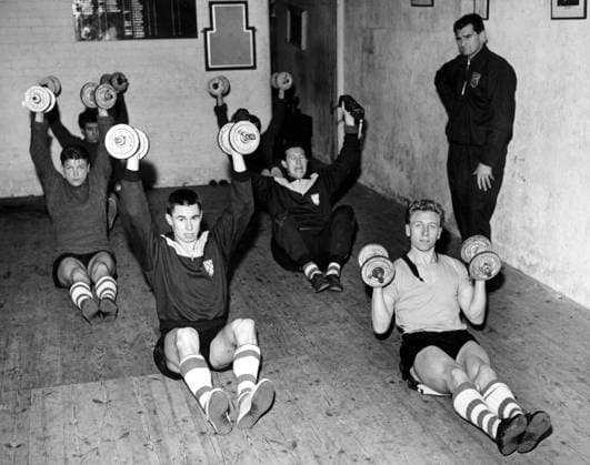 Training West Ham United players train at Hove - Bill Watson, Olympic weight training coach, stands by at the King Alfred Sports Centre, Hove. The front pair are Woosnam (l) and Obeney (r), and behind are Dwyer (l) and Brown (r). 6th January 1960 Great Britain  Copyright: xTopFotox 0552135