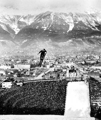 1964 Winter Olympics 1964 Winter Olympic Games, Olympische Spiele, Olympia, OS - Innsbruck, Austria Watched by 80,000 spectators a competitor - one of fifty-two from fifteen nations - flies through the air after taking off from a platform 480 ft high, during the 80m ski jump at Innsbruck - the final event of the ninth Winter Olympic Games. The competitors take off at speeds of about 60mph to sail for three seconds or so through the air - reaching speeds of over 67 mph - and finally landing as far as 313 feet away from the spot where they had lost contact with the ground. - 10th February 1964 - TopFoto Austria  Copyright: xTopFotox 0944442