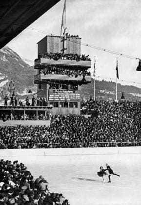 Maxie Herber & Ernst Baier 1936 Olympics - Everyone turned out to see the triumph of the pair of masters Maxie Herber & Ernst Baier - pair skaters. Ernst Baier (born September 27, 1905 in Zittau, Saxony, Germany - died July 8, 2001 in Garmisch, Bavaria, Germany) was a German figure skater. He became Olympic champion in pairs in 1936 together with Maxi Herber. The pair skaters also won several World and European championships. TopFoto Germany  Copyright: xTopFotox 1029425