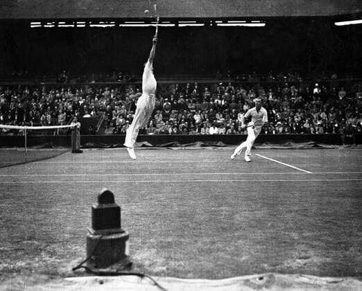 1937 American Davis Cup Team Donald Budge and Gene Mako , the Americans who are the Wimbledon Champion , took the first two sets 6-3 7-5 from Raymond Tuckey and Frank Wilde in the doubles of the Davis Cup Challenge Round at Wimbledon , England . Seen here Budge leapng for a high ball 26 July 1937 United Kingdom England  Copyright: xTopFotox 1309199