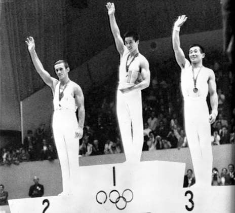 Olympic gymnastics Mexico City : Medal winners of the Men s Combined Gymnastics on the victory podium in Mexico City . From left: Mikhail Voronin ( USSR ), silver ; Sawao Kato ( Japan ), Gold and Akinori Nakayama , also Japan , Bronze 25 October 1968 Mexico  Copyright: xTopFotox 1380707