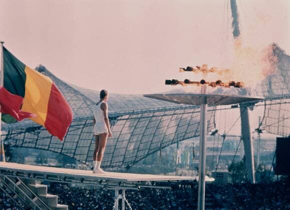 Olympic Opening Ceremony Olympic Opening Ceremony West German medium distance runner Gunter Zarn stands near the Olympic flame during opening ceremony at the Olympic Stadium in Munich . 26th August 1972 Germany  Copyright: xTopFotox UPI1288698