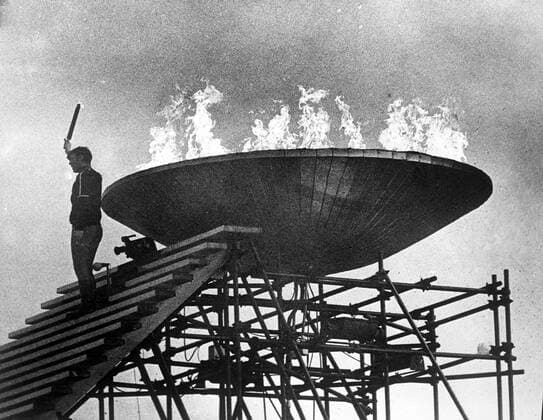 Olympic Opening Olympic Opening French Athlete Alain Calmat stands on top of the 90 foot high tower after lighting the Olympic Flame , which will burn during the 10th Winter Olympic Games, Olympische Spiele, Olympia, OS 6th February 1968 France  Copyright: xTopFotox UPI550340