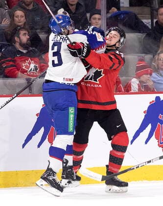 Eishockey, U20 Länderspiel, Kanada - Slowakei December 21, 2022, Moncton, NB, Canada: Slovakia s Simon Becar hits Canada s Zach Dean during second period IIHF World Junior Hockey Championship pre-tournament hockey action in Moncton, N.B., on Wednesday, Dec. 21, 2022. Canada News - December 21, 2022  - ZUMAc35_ 20221221_zaf_c35_056 Copyright: xRonxWardx