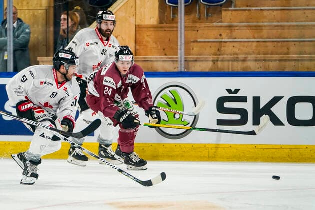 DAVOS, SWITZERLAND DECEMBER 26 David Desharnais of Team Canada L against Tomas Tomek of Sparta Prague during the match between HC Sparta Praha and Team Canada at Hockey Club Davos on December 26, 2022 in Davos, Switzerland Davos Graubunden Switzerland  Copyright: xJustPictures.ch JarixPestelaccix
