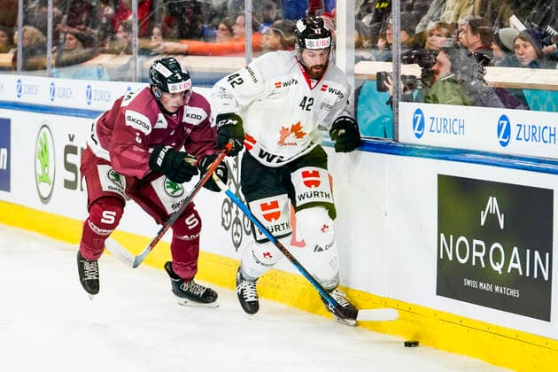 DAVOS, SWITZERLAND DECEMBER 26 Brendan Perlini of Team Canada against Michael Krutil of Sparta Prague during the match between HC Sparta Praha and Team Canada at Hockey Club Davos on December 26, 2022 in Davos, Switzerland Davos Graubunden Switzerland  Copyright: xJustPictures.ch JarixPestelaccix